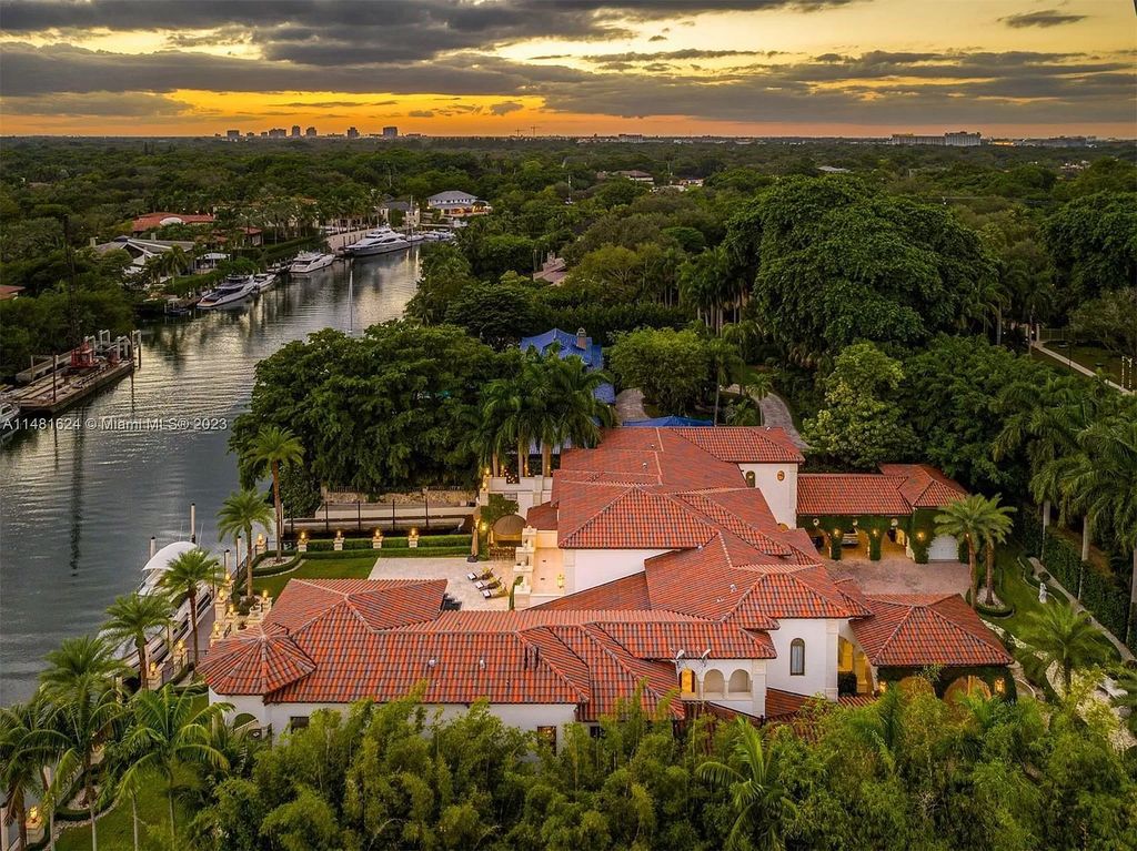 Indulge in the pinnacle of waterfront luxury at 150 Edgewater Drive, Coral Gables. This Mediterranean-style estate, nestled on prestigious Edgewater Drive, boasts 180 feet of deep-water frontage, an 80-foot inlet slip, and direct bay access - a paradise for boating enthusiasts.