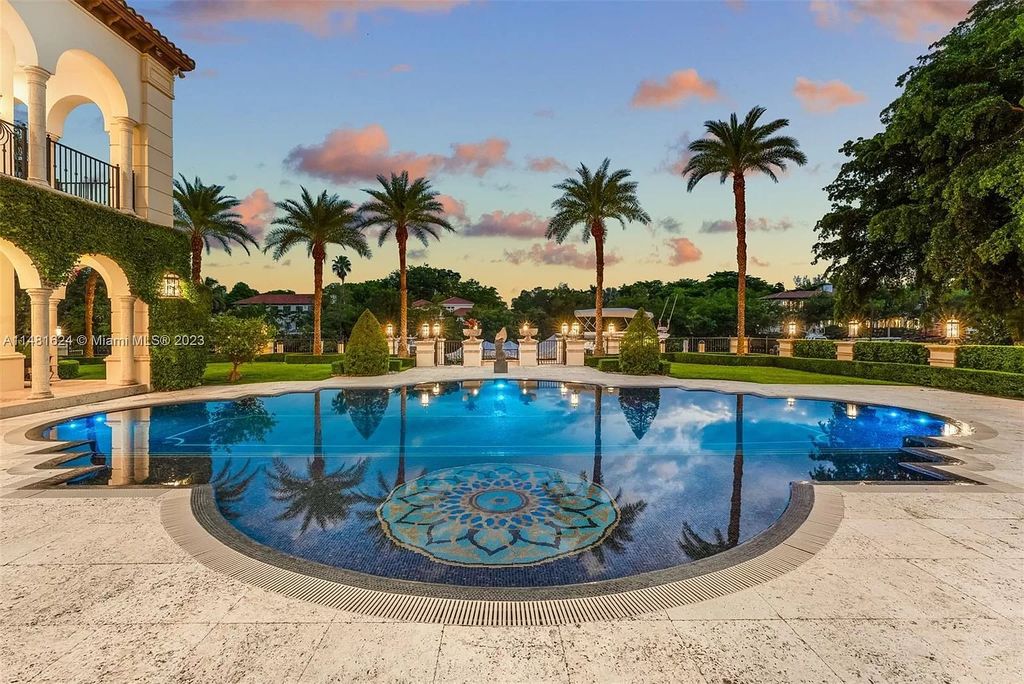 Indulge in the pinnacle of waterfront luxury at 150 Edgewater Drive, Coral Gables. This Mediterranean-style estate, nestled on prestigious Edgewater Drive, boasts 180 feet of deep-water frontage, an 80-foot inlet slip, and direct bay access - a paradise for boating enthusiasts.