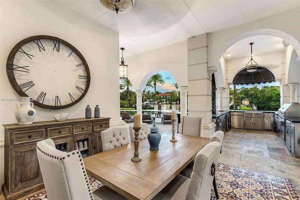Indulge in the pinnacle of waterfront luxury at 150 Edgewater Drive, Coral Gables. This Mediterranean-style estate, nestled on prestigious Edgewater Drive, boasts 180 feet of deep-water frontage, an 80-foot inlet slip, and direct bay access - a paradise for boating enthusiasts.