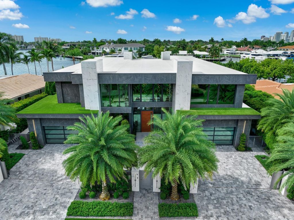 Welcome to 671 Middle River Dr, Fort Lauderdale – a 2020 Prestige-built masterpiece in a gated waterfront community. This 9,138sqft smart home boasts 5 beds, 9 baths, and designer finishes throughout.