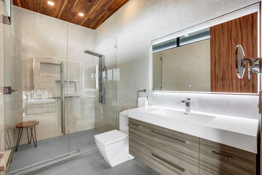 Welcome to 671 Middle River Dr, Fort Lauderdale – a 2020 Prestige-built masterpiece in a gated waterfront community. This 9,138sqft smart home boasts 5 beds, 9 baths, and designer finishes throughout.