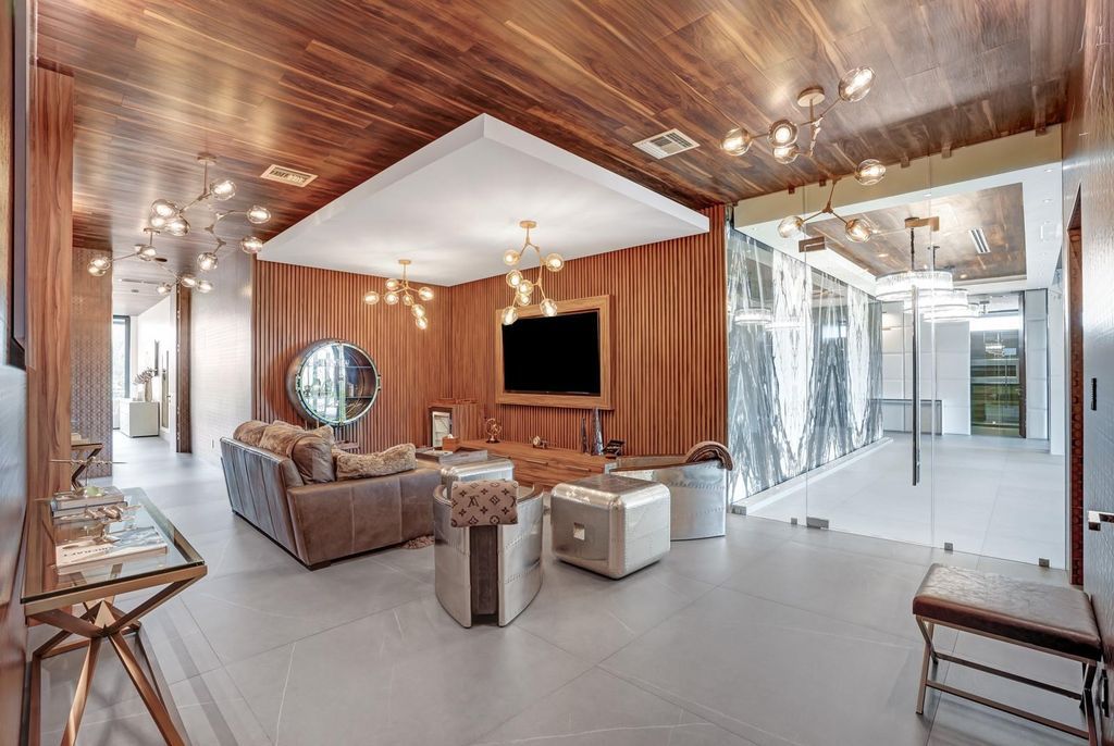 Welcome to 671 Middle River Dr, Fort Lauderdale – a 2020 Prestige-built masterpiece in a gated waterfront community. This 9,138sqft smart home boasts 5 beds, 9 baths, and designer finishes throughout.