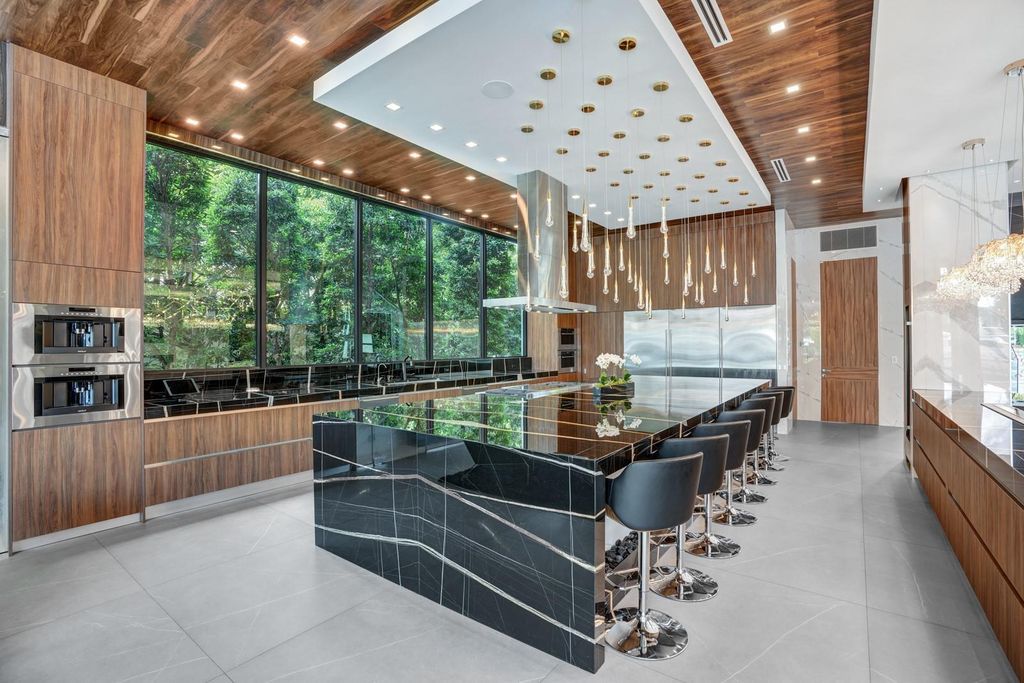 Welcome to 671 Middle River Dr, Fort Lauderdale – a 2020 Prestige-built masterpiece in a gated waterfront community. This 9,138sqft smart home boasts 5 beds, 9 baths, and designer finishes throughout.