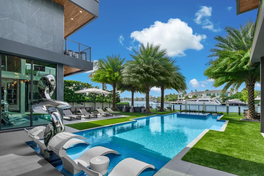 Welcome to 671 Middle River Dr, Fort Lauderdale – a 2020 Prestige-built masterpiece in a gated waterfront community. This 9,138sqft smart home boasts 5 beds, 9 baths, and designer finishes throughout.