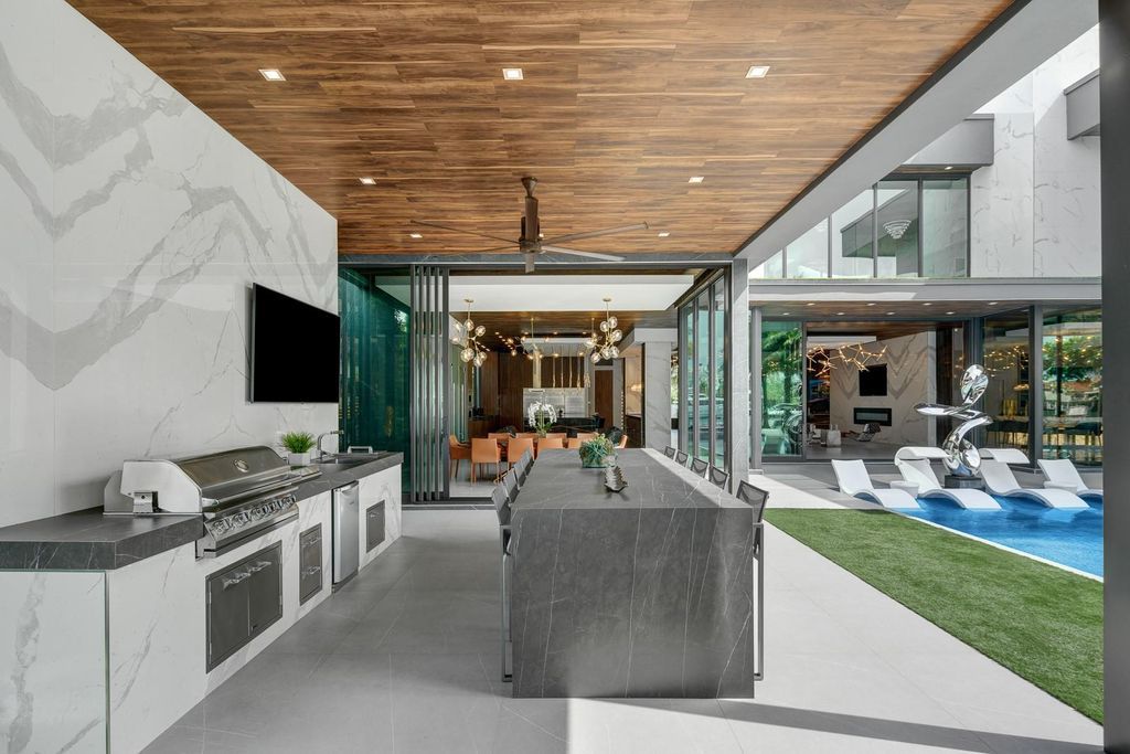 Welcome to 671 Middle River Dr, Fort Lauderdale – a 2020 Prestige-built masterpiece in a gated waterfront community. This 9,138sqft smart home boasts 5 beds, 9 baths, and designer finishes throughout.
