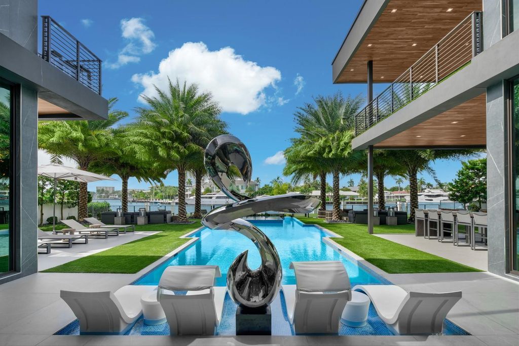 Welcome to 671 Middle River Dr, Fort Lauderdale – a 2020 Prestige-built masterpiece in a gated waterfront community. This 9,138sqft smart home boasts 5 beds, 9 baths, and designer finishes throughout.