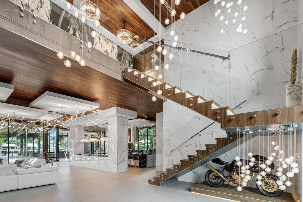 Welcome to 671 Middle River Dr, Fort Lauderdale – a 2020 Prestige-built masterpiece in a gated waterfront community. This 9,138sqft smart home boasts 5 beds, 9 baths, and designer finishes throughout.