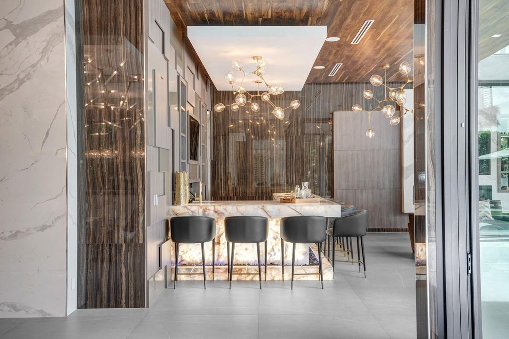 Welcome to 671 Middle River Dr, Fort Lauderdale – a 2020 Prestige-built masterpiece in a gated waterfront community. This 9,138sqft smart home boasts 5 beds, 9 baths, and designer finishes throughout.