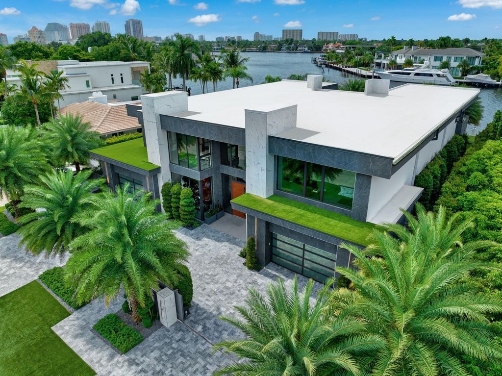 Welcome to 671 Middle River Dr, Fort Lauderdale – a 2020 Prestige-built masterpiece in a gated waterfront community. This 9,138sqft smart home boasts 5 beds, 9 baths, and designer finishes throughout.