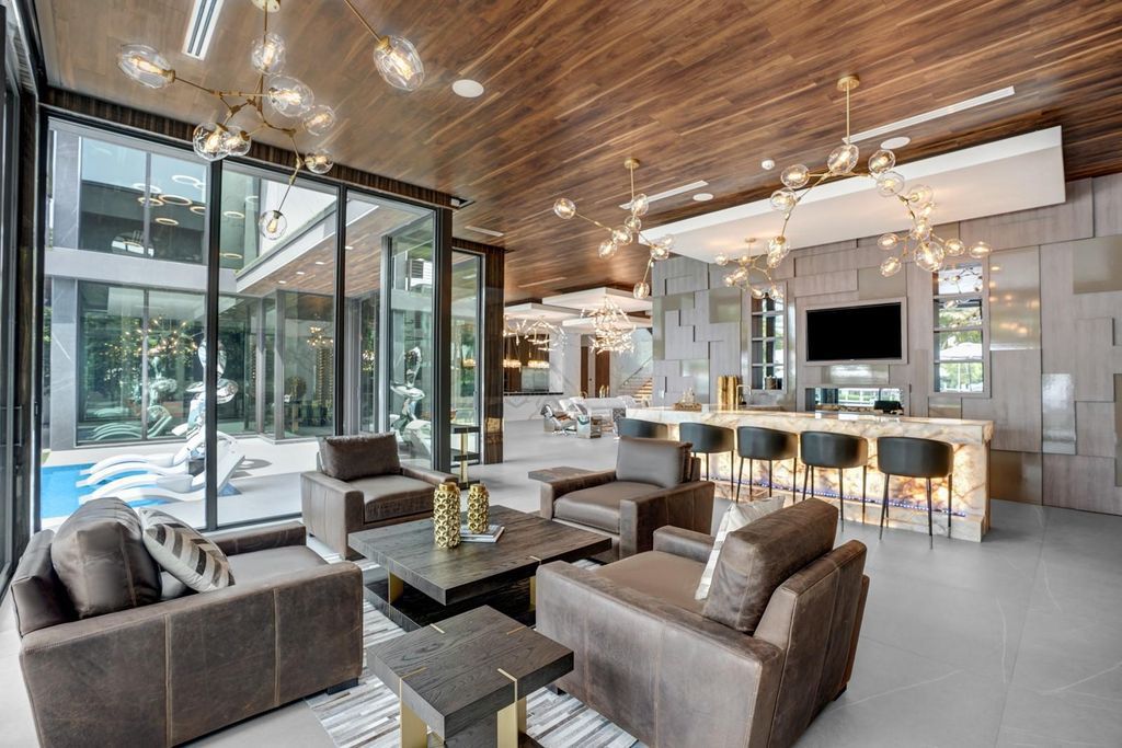 Welcome to 671 Middle River Dr, Fort Lauderdale – a 2020 Prestige-built masterpiece in a gated waterfront community. This 9,138sqft smart home boasts 5 beds, 9 baths, and designer finishes throughout.