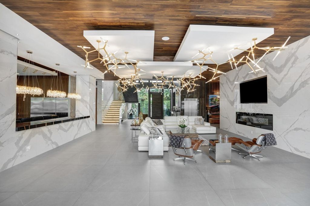 Welcome to 671 Middle River Dr, Fort Lauderdale – a 2020 Prestige-built masterpiece in a gated waterfront community. This 9,138sqft smart home boasts 5 beds, 9 baths, and designer finishes throughout.