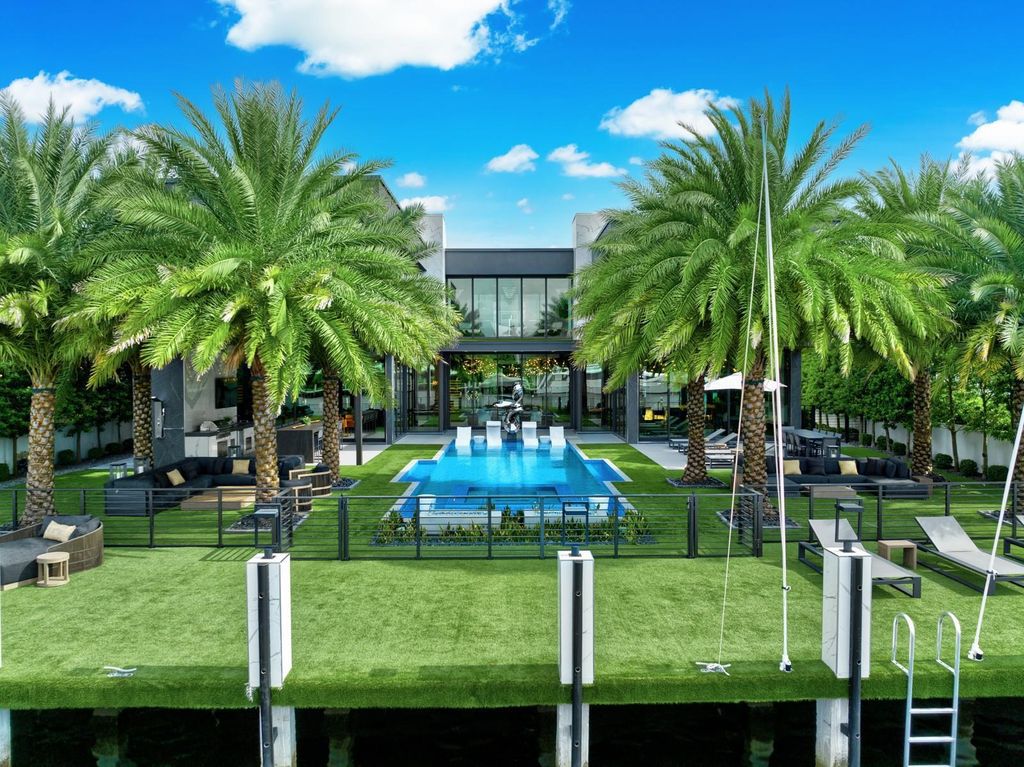 Welcome to 671 Middle River Dr, Fort Lauderdale – a 2020 Prestige-built masterpiece in a gated waterfront community. This 9,138sqft smart home boasts 5 beds, 9 baths, and designer finishes throughout.