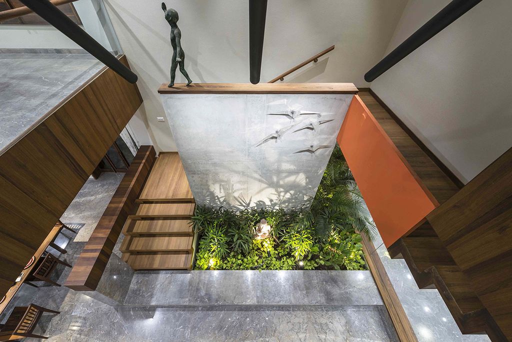 L House Combines Stark and Clean volumes by The Grid Architects