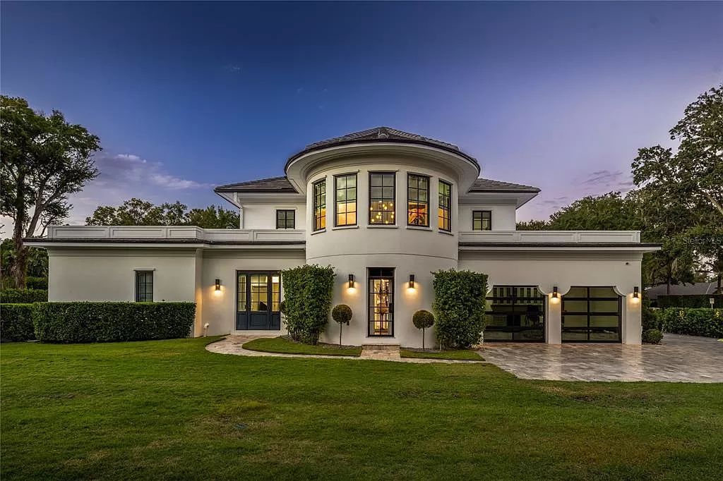 Discover Winter Park's epitome of luxury living in this architectural masterpiece by award-winning architect Larry Boerder. Just steps from Park Avenue's upscale boutiques and restaurants, this 2021-built estate boasts opulence at every turn.