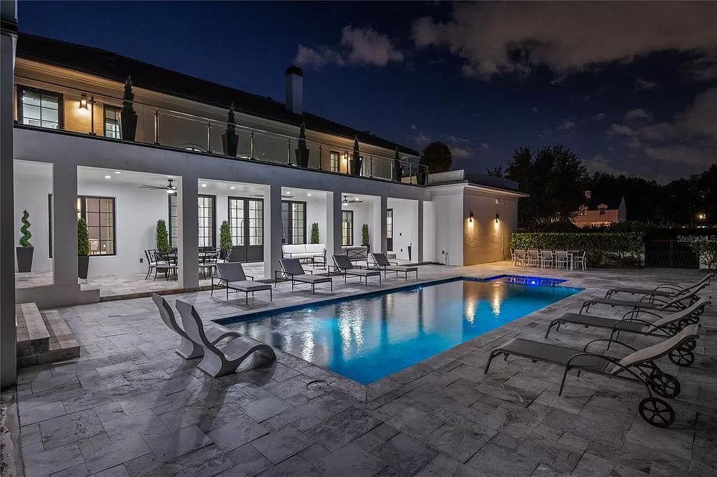 Discover Winter Park's epitome of luxury living in this architectural masterpiece by award-winning architect Larry Boerder. Just steps from Park Avenue's upscale boutiques and restaurants, this 2021-built estate boasts opulence at every turn.