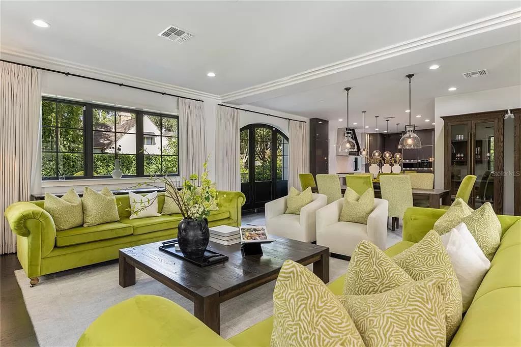 Discover Winter Park's epitome of luxury living in this architectural masterpiece by award-winning architect Larry Boerder. Just steps from Park Avenue's upscale boutiques and restaurants, this 2021-built estate boasts opulence at every turn.