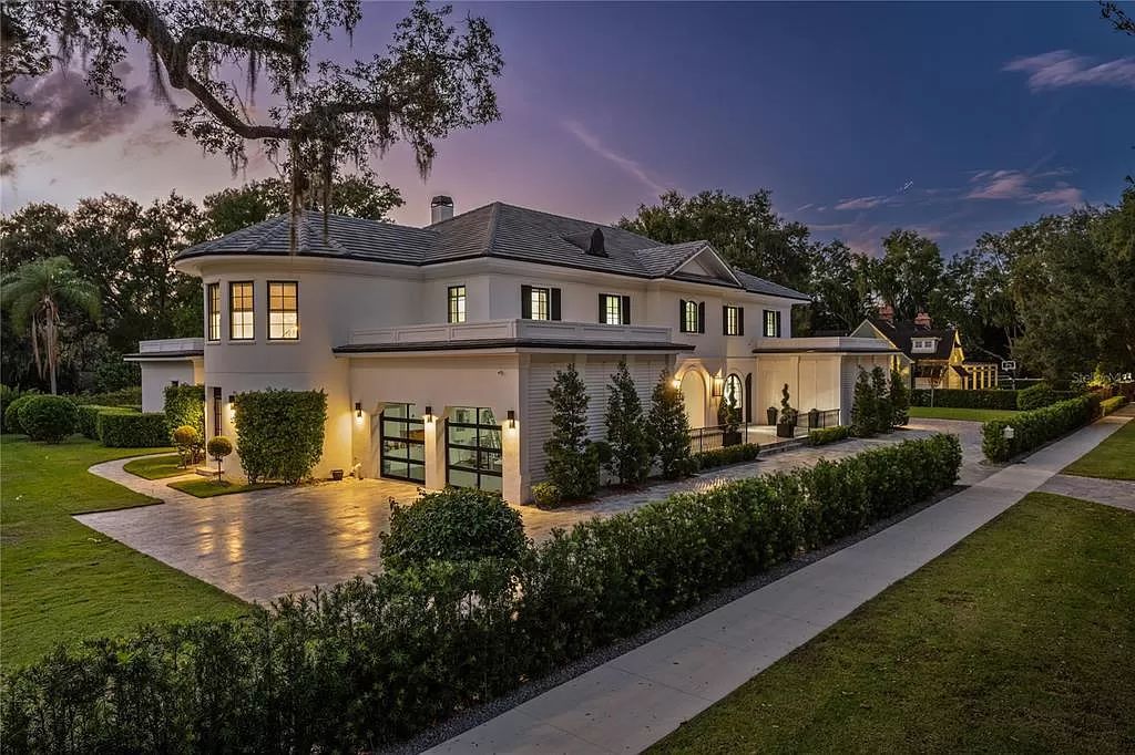 Discover Winter Park's epitome of luxury living in this architectural masterpiece by award-winning architect Larry Boerder. Just steps from Park Avenue's upscale boutiques and restaurants, this 2021-built estate boasts opulence at every turn.