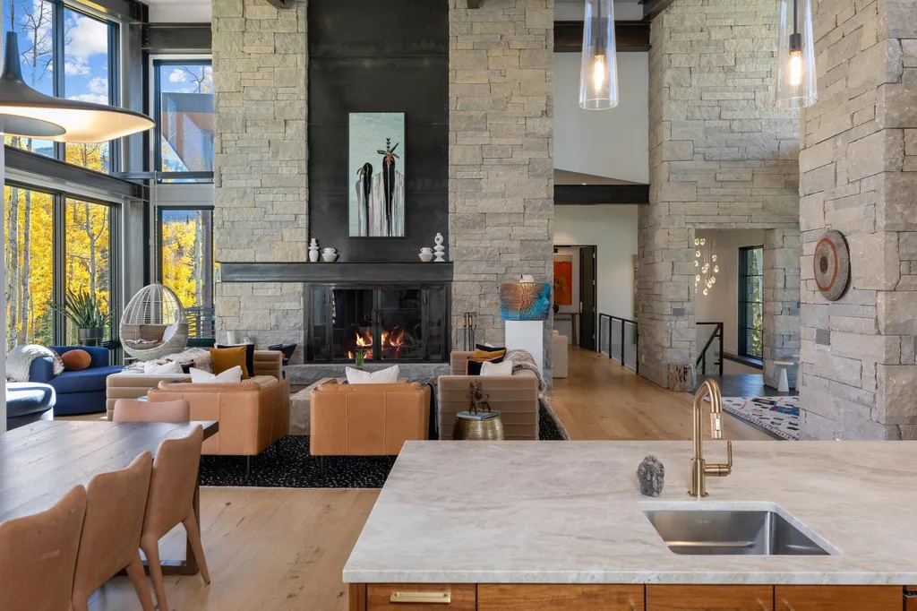110 Highlands Way Home in Mountain Village, Colorado. Discover the epitome of mountain living in this 5-bedroom, 7.5-bathroom luxury home with direct ski-in/ski-out access via the Galloping Goose trail. Recently constructed, this mountain modern retreat offers breathtaking San Sophia mountain views, an open-concept design, and high-end finishes. 