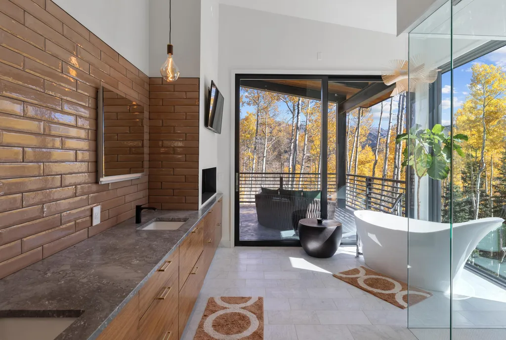 110 Highlands Way Home in Mountain Village, Colorado. Discover the epitome of mountain living in this 5-bedroom, 7.5-bathroom luxury home with direct ski-in/ski-out access via the Galloping Goose trail. Recently constructed, this mountain modern retreat offers breathtaking San Sophia mountain views, an open-concept design, and high-end finishes. 