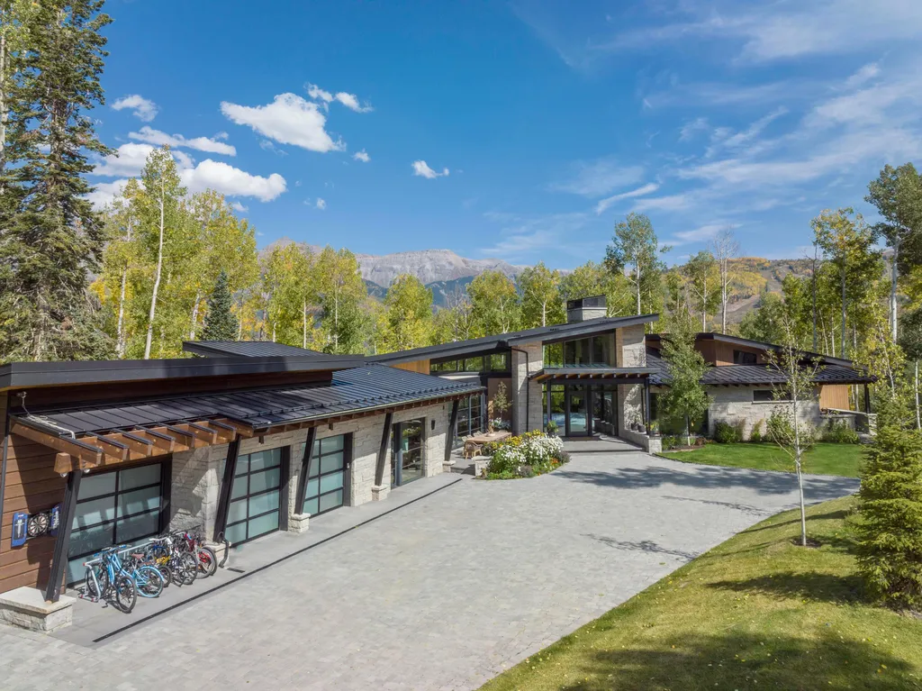 110 Highlands Way Home in Mountain Village, Colorado. Discover the epitome of mountain living in this 5-bedroom, 7.5-bathroom luxury home with direct ski-in/ski-out access via the Galloping Goose trail. Recently constructed, this mountain modern retreat offers breathtaking San Sophia mountain views, an open-concept design, and high-end finishes. 