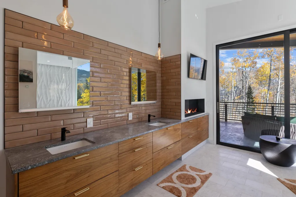 110 Highlands Way Home in Mountain Village, Colorado. Discover the epitome of mountain living in this 5-bedroom, 7.5-bathroom luxury home with direct ski-in/ski-out access via the Galloping Goose trail. Recently constructed, this mountain modern retreat offers breathtaking San Sophia mountain views, an open-concept design, and high-end finishes. 