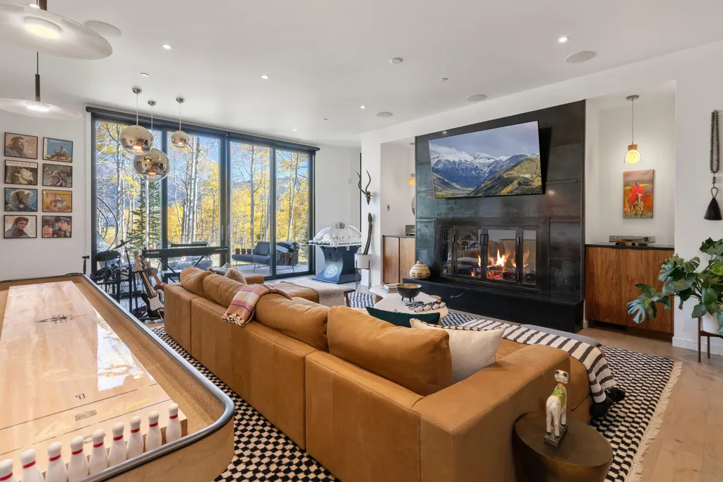 110 Highlands Way Home in Mountain Village, Colorado. Discover the epitome of mountain living in this 5-bedroom, 7.5-bathroom luxury home with direct ski-in/ski-out access via the Galloping Goose trail. Recently constructed, this mountain modern retreat offers breathtaking San Sophia mountain views, an open-concept design, and high-end finishes. 