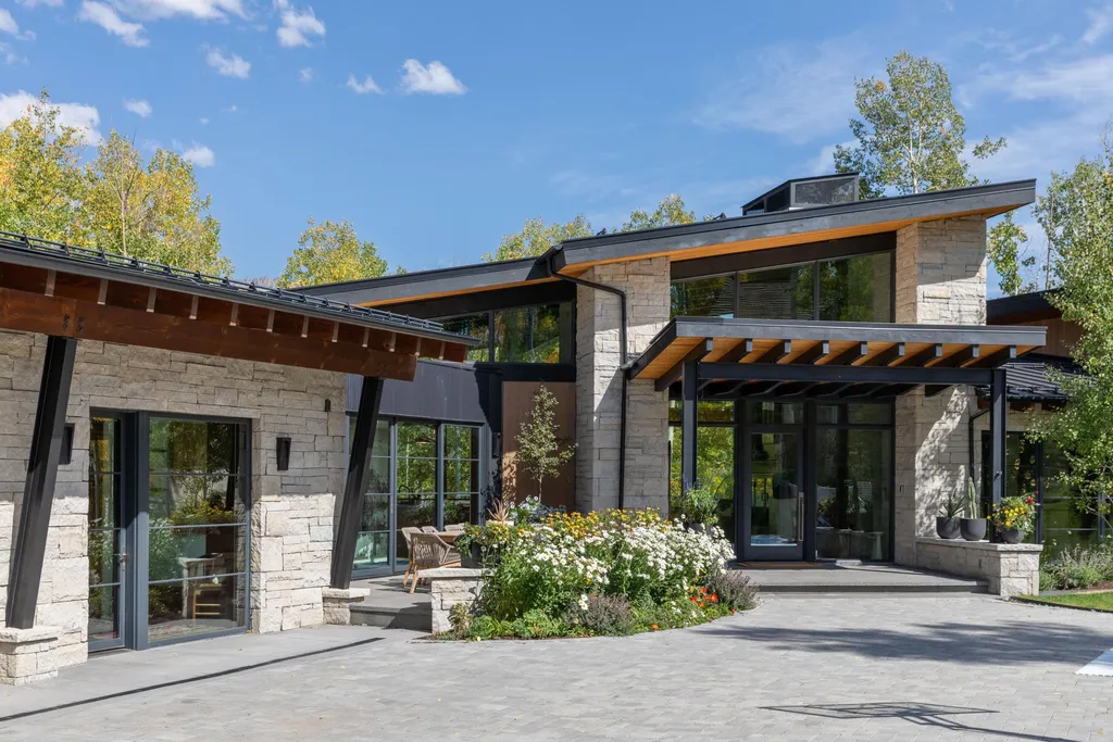 110 Highlands Way Home in Mountain Village, Colorado. Discover the epitome of mountain living in this 5-bedroom, 7.5-bathroom luxury home with direct ski-in/ski-out access via the Galloping Goose trail. Recently constructed, this mountain modern retreat offers breathtaking San Sophia mountain views, an open-concept design, and high-end finishes. 