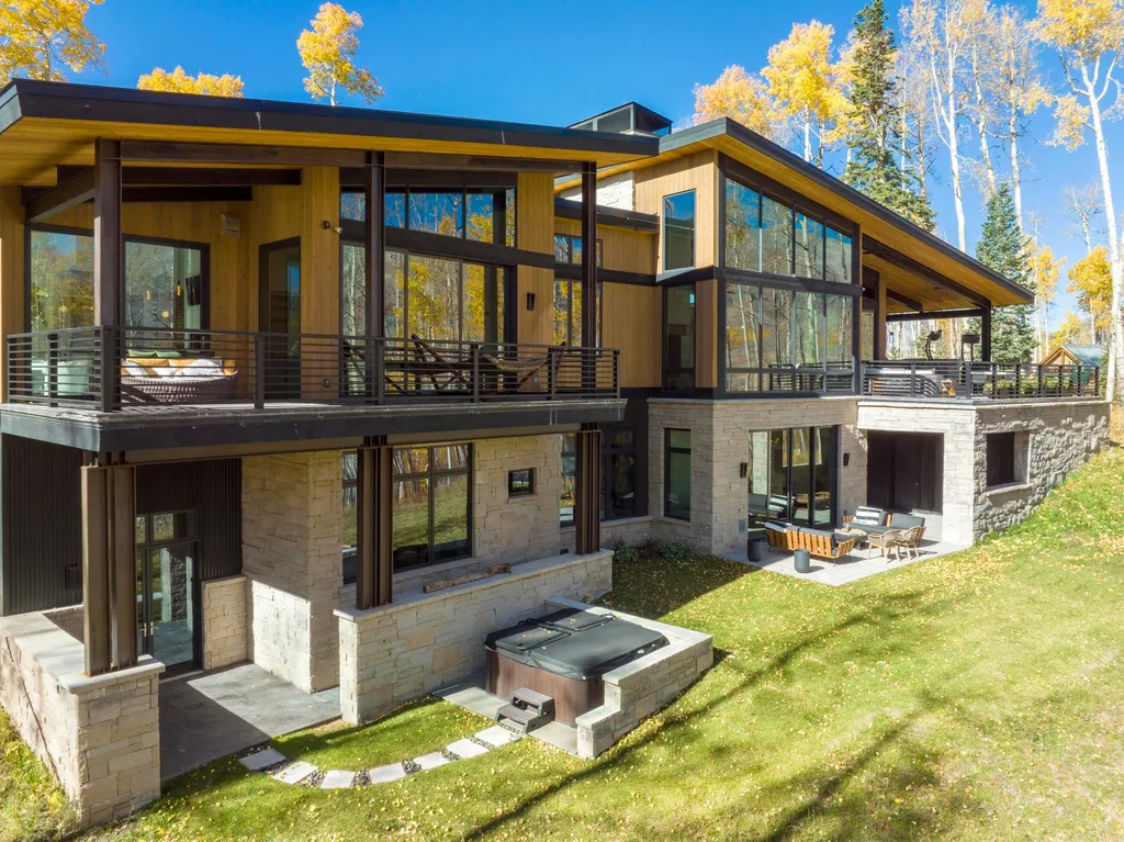 110 Highlands Way Home in Mountain Village, Colorado. Discover the epitome of mountain living in this 5-bedroom, 7.5-bathroom luxury home with direct ski-in/ski-out access via the Galloping Goose trail. Recently constructed, this mountain modern retreat offers breathtaking San Sophia mountain views, an open-concept design, and high-end finishes. 