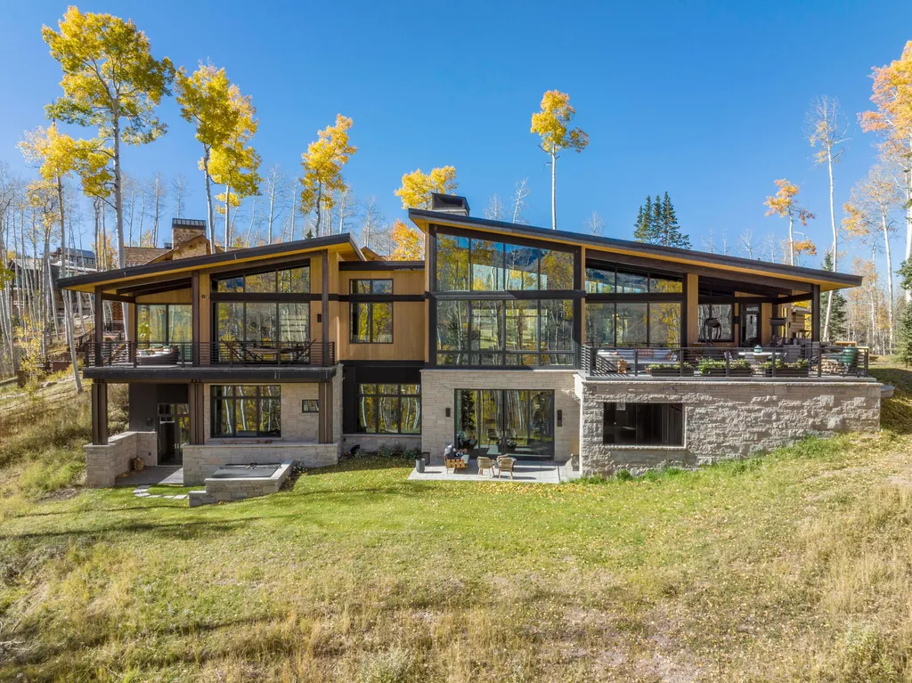 110 Highlands Way Home in Mountain Village, Colorado. Discover the epitome of mountain living in this 5-bedroom, 7.5-bathroom luxury home with direct ski-in/ski-out access via the Galloping Goose trail. Recently constructed, this mountain modern retreat offers breathtaking San Sophia mountain views, an open-concept design, and high-end finishes. 