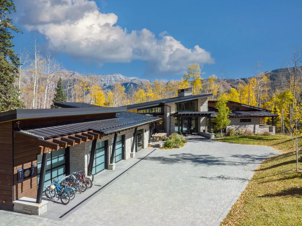 110 Highlands Way Home in Mountain Village, Colorado. Discover the epitome of mountain living in this 5-bedroom, 7.5-bathroom luxury home with direct ski-in/ski-out access via the Galloping Goose trail. Recently constructed, this mountain modern retreat offers breathtaking San Sophia mountain views, an open-concept design, and high-end finishes. 