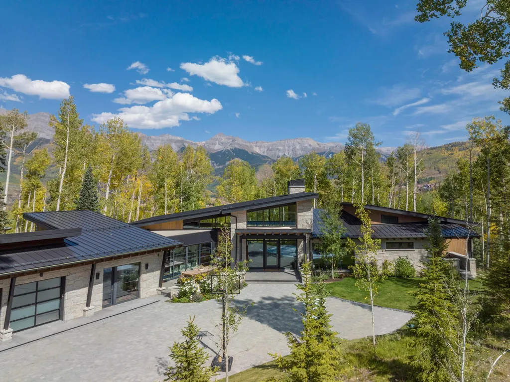 110 Highlands Way Home in Mountain Village, Colorado. Discover the epitome of mountain living in this 5-bedroom, 7.5-bathroom luxury home with direct ski-in/ski-out access via the Galloping Goose trail. Recently constructed, this mountain modern retreat offers breathtaking San Sophia mountain views, an open-concept design, and high-end finishes. 