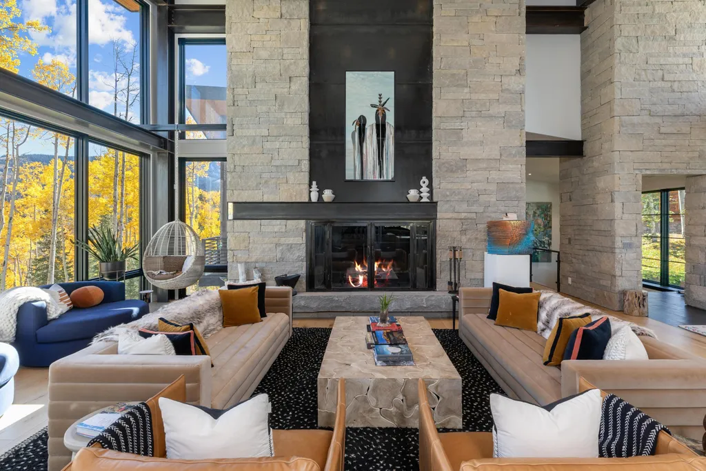 110 Highlands Way Home in Mountain Village, Colorado. Discover the epitome of mountain living in this 5-bedroom, 7.5-bathroom luxury home with direct ski-in/ski-out access via the Galloping Goose trail. Recently constructed, this mountain modern retreat offers breathtaking San Sophia mountain views, an open-concept design, and high-end finishes. 