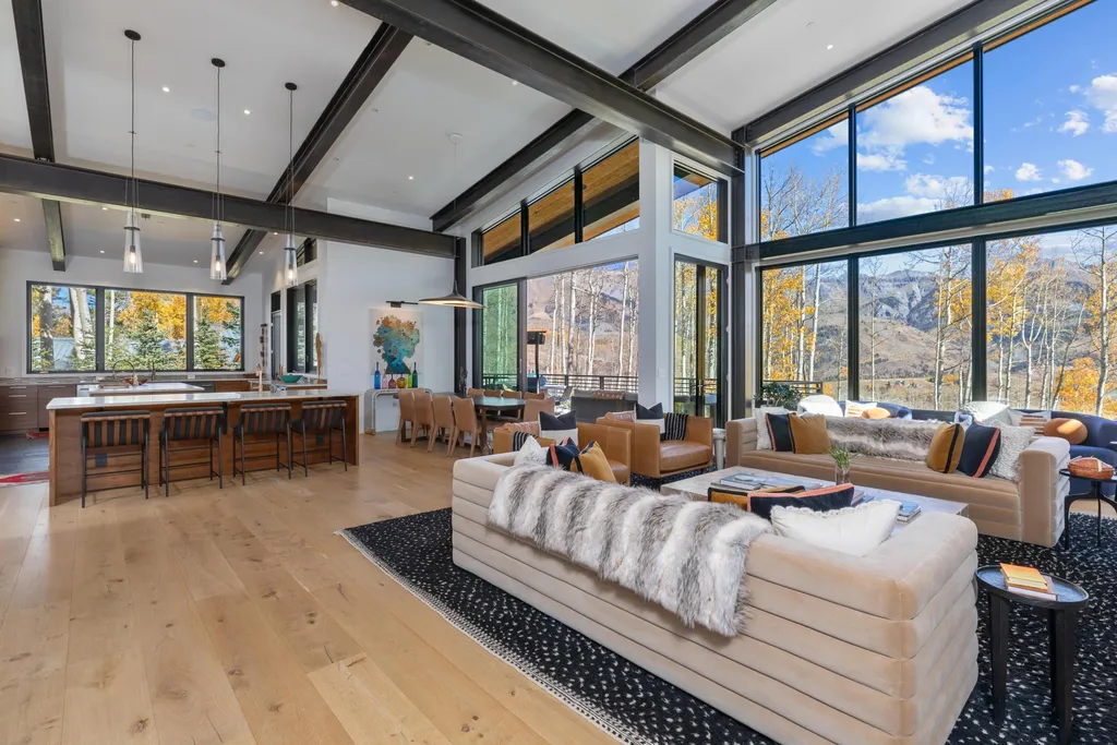 110 Highlands Way Home in Mountain Village, Colorado. Discover the epitome of mountain living in this 5-bedroom, 7.5-bathroom luxury home with direct ski-in/ski-out access via the Galloping Goose trail. Recently constructed, this mountain modern retreat offers breathtaking San Sophia mountain views, an open-concept design, and high-end finishes. 