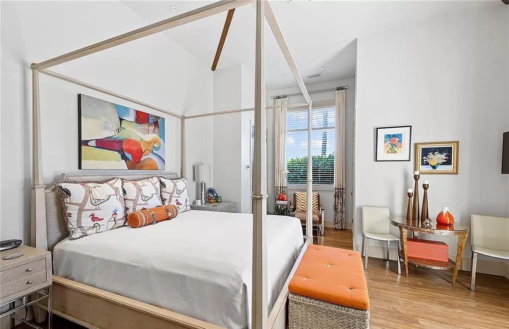 Discover the epitome of luxury living in the heart of Naples at 655 Bougainvillea Rd. This exquisite 7,660-square-foot lakefront estate, crafted by renowned architect John Cooney, boasts a seamless blend of warm tones and minimalist design.