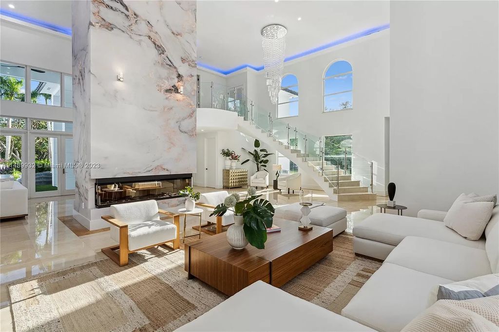 Welcome to the epitome of contemporary luxury living in Pinecrest! This striking newly constructed family compound offers a seamless blend of timeless transitional style and modern functionality. Spanning 7,778 square feet on a lush 0.89-acre lot, this masterpiece features two separate family quarters with flexible spaces, ideal for multi-generational living or personalized workspaces.