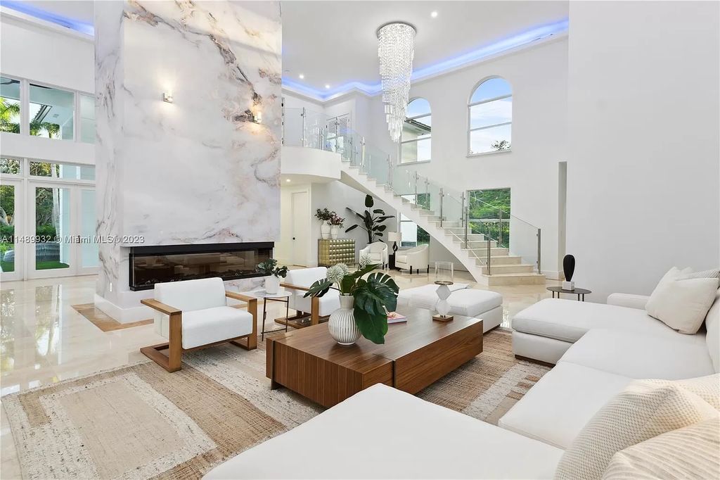Welcome to the epitome of contemporary luxury living in Pinecrest! This striking newly constructed family compound offers a seamless blend of timeless transitional style and modern functionality. Spanning 7,778 square feet on a lush 0.89-acre lot, this masterpiece features two separate family quarters with flexible spaces, ideal for multi-generational living or personalized workspaces.