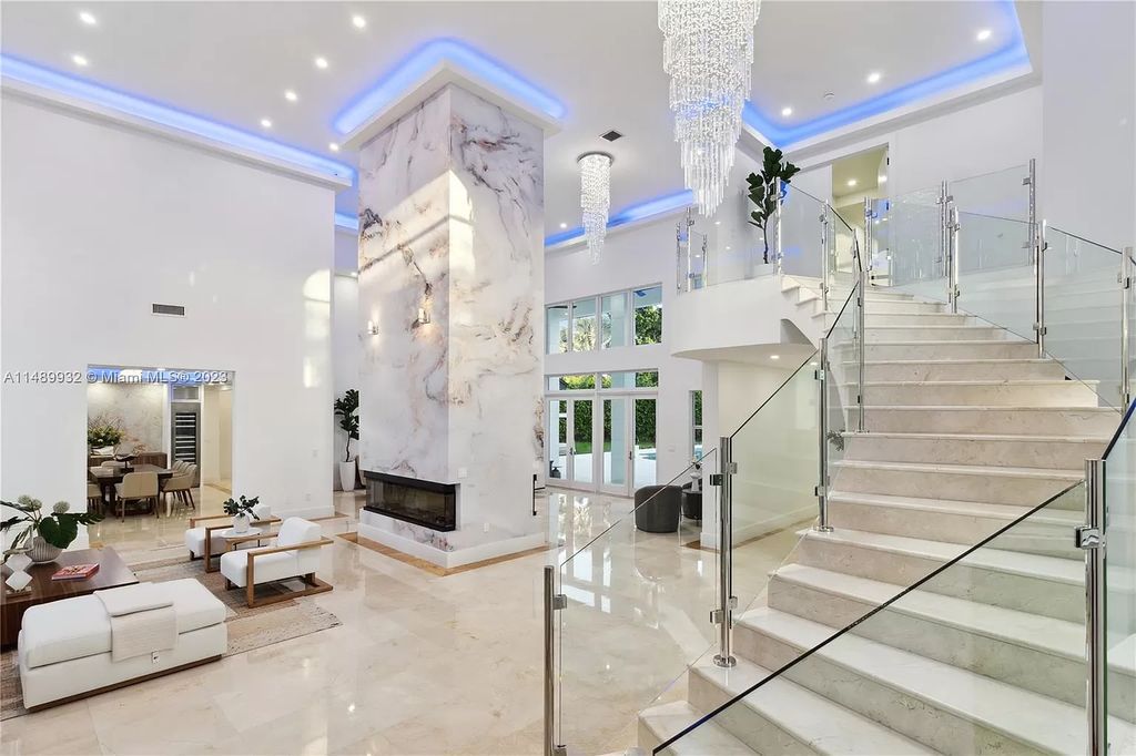 Welcome to the epitome of contemporary luxury living in Pinecrest! This striking newly constructed family compound offers a seamless blend of timeless transitional style and modern functionality. Spanning 7,778 square feet on a lush 0.89-acre lot, this masterpiece features two separate family quarters with flexible spaces, ideal for multi-generational living or personalized workspaces.