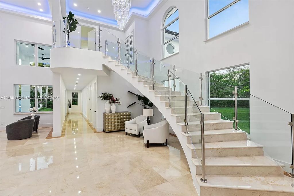 Welcome to the epitome of contemporary luxury living in Pinecrest! This striking newly constructed family compound offers a seamless blend of timeless transitional style and modern functionality. Spanning 7,778 square feet on a lush 0.89-acre lot, this masterpiece features two separate family quarters with flexible spaces, ideal for multi-generational living or personalized workspaces.