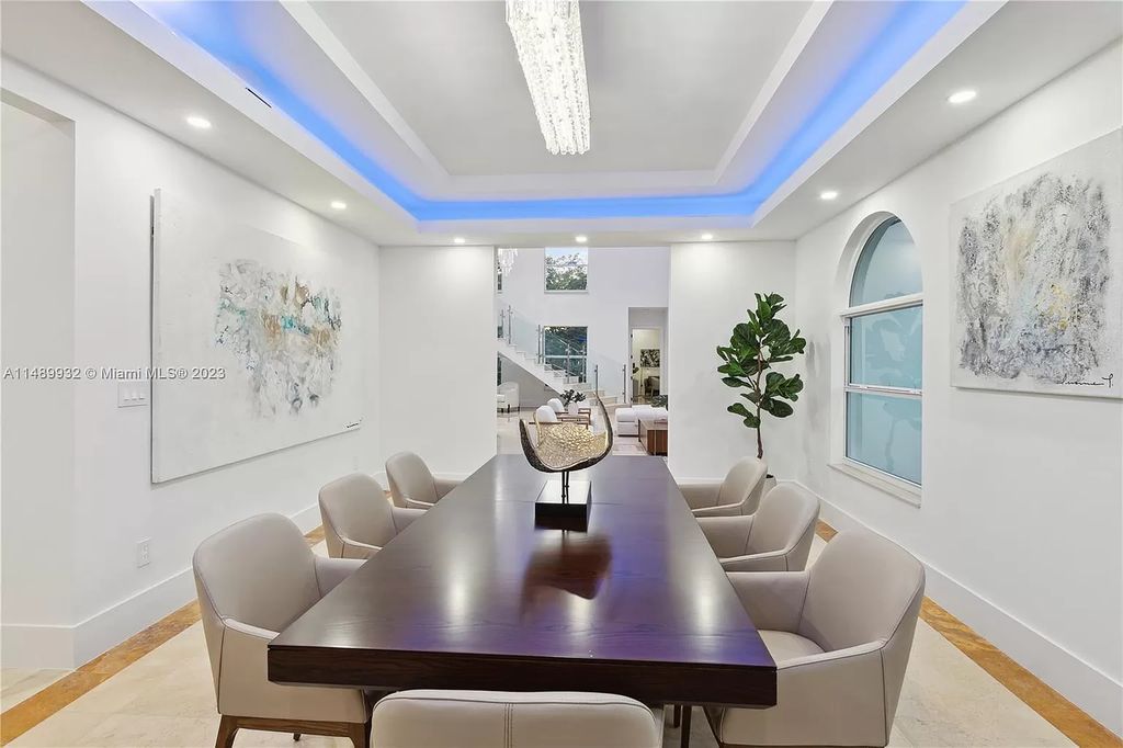 Welcome to the epitome of contemporary luxury living in Pinecrest! This striking newly constructed family compound offers a seamless blend of timeless transitional style and modern functionality. Spanning 7,778 square feet on a lush 0.89-acre lot, this masterpiece features two separate family quarters with flexible spaces, ideal for multi-generational living or personalized workspaces.