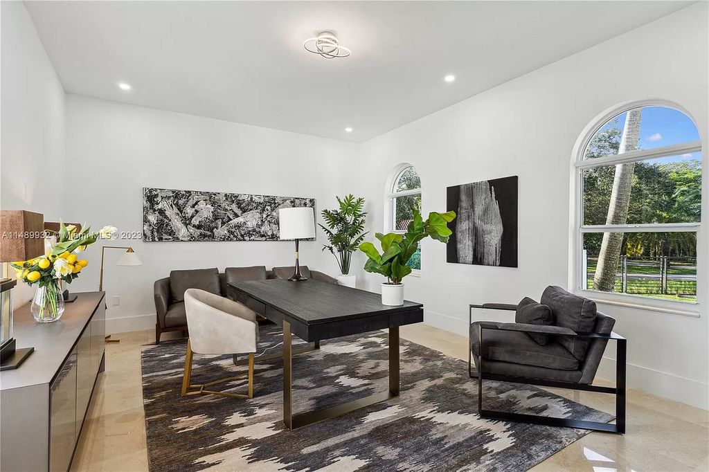 Welcome to the epitome of contemporary luxury living in Pinecrest! This striking newly constructed family compound offers a seamless blend of timeless transitional style and modern functionality. Spanning 7,778 square feet on a lush 0.89-acre lot, this masterpiece features two separate family quarters with flexible spaces, ideal for multi-generational living or personalized workspaces.