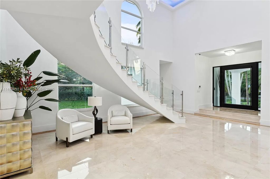 Welcome to the epitome of contemporary luxury living in Pinecrest! This striking newly constructed family compound offers a seamless blend of timeless transitional style and modern functionality. Spanning 7,778 square feet on a lush 0.89-acre lot, this masterpiece features two separate family quarters with flexible spaces, ideal for multi-generational living or personalized workspaces.