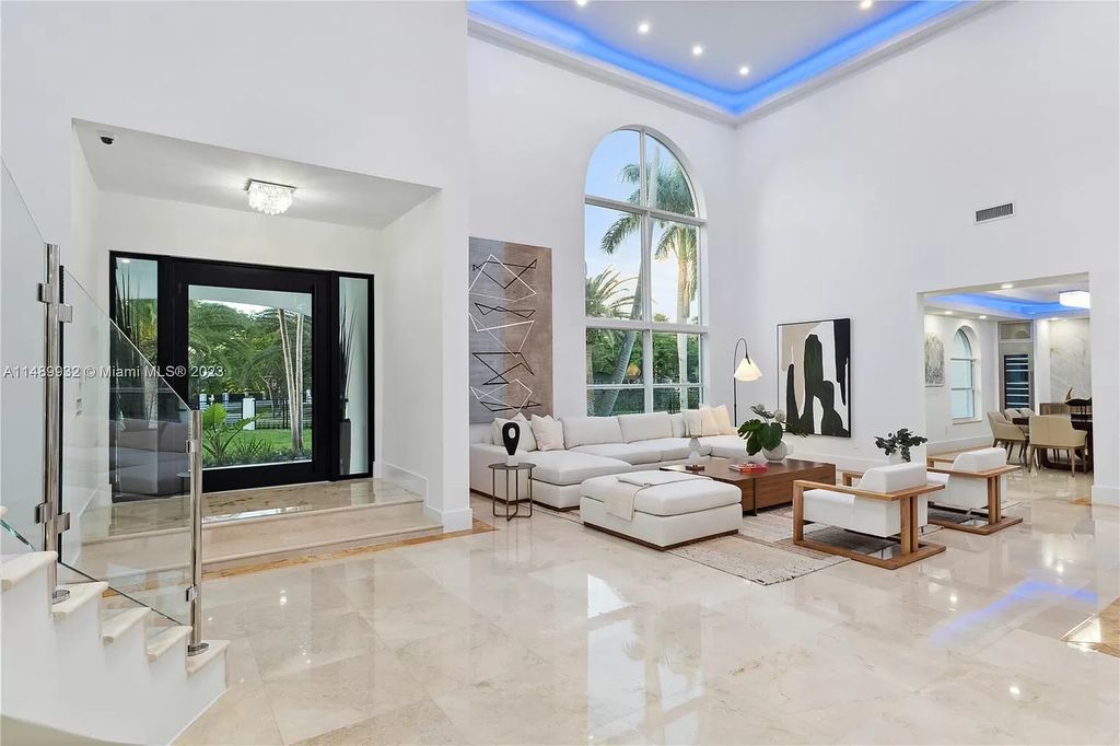 Welcome to the epitome of contemporary luxury living in Pinecrest! This striking newly constructed family compound offers a seamless blend of timeless transitional style and modern functionality. Spanning 7,778 square feet on a lush 0.89-acre lot, this masterpiece features two separate family quarters with flexible spaces, ideal for multi-generational living or personalized workspaces.