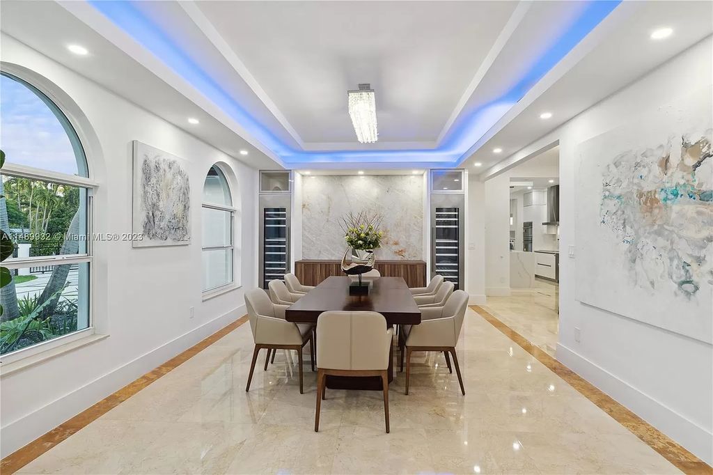 Welcome to the epitome of contemporary luxury living in Pinecrest! This striking newly constructed family compound offers a seamless blend of timeless transitional style and modern functionality. Spanning 7,778 square feet on a lush 0.89-acre lot, this masterpiece features two separate family quarters with flexible spaces, ideal for multi-generational living or personalized workspaces.