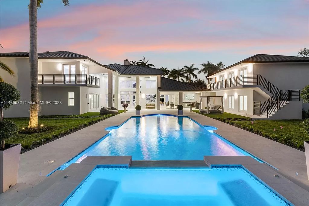 Welcome to the epitome of contemporary luxury living in Pinecrest! This striking newly constructed family compound offers a seamless blend of timeless transitional style and modern functionality. Spanning 7,778 square feet on a lush 0.89-acre lot, this masterpiece features two separate family quarters with flexible spaces, ideal for multi-generational living or personalized workspaces.