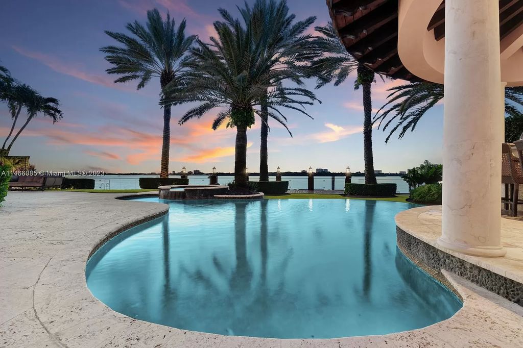Experience the epitome of Mediterranean luxury at 230 Bal Bay Dr, an exclusive waterfront estate in Bal Harbour Village. Crafted by the esteemed Alexander Group, this custom-built masterpiece boasts exquisite details like custom millwork, Jerusalem stone flooring, and marble accents throughout.