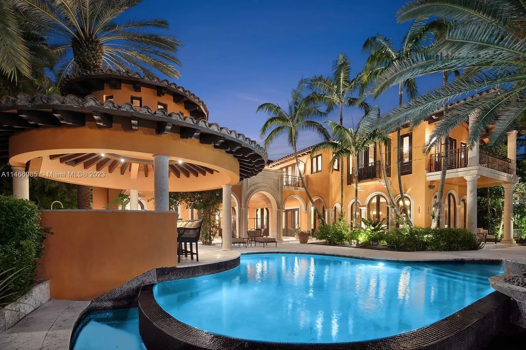Experience the epitome of Mediterranean luxury at 230 Bal Bay Dr, an exclusive waterfront estate in Bal Harbour Village. Crafted by the esteemed Alexander Group, this custom-built masterpiece boasts exquisite details like custom millwork, Jerusalem stone flooring, and marble accents throughout.