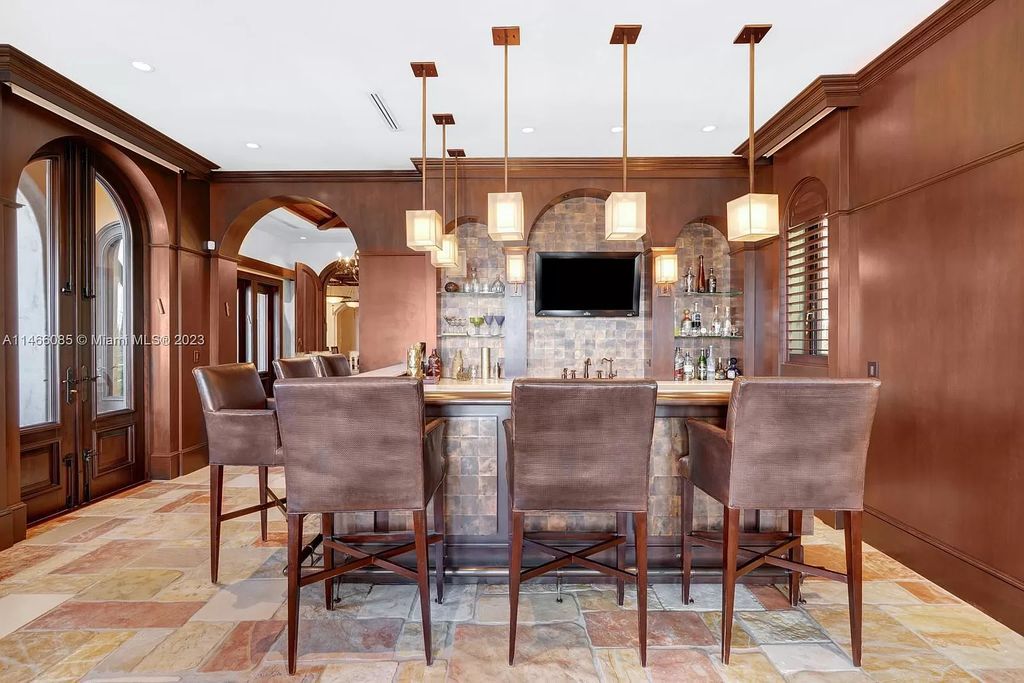 Experience the epitome of Mediterranean luxury at 230 Bal Bay Dr, an exclusive waterfront estate in Bal Harbour Village. Crafted by the esteemed Alexander Group, this custom-built masterpiece boasts exquisite details like custom millwork, Jerusalem stone flooring, and marble accents throughout.