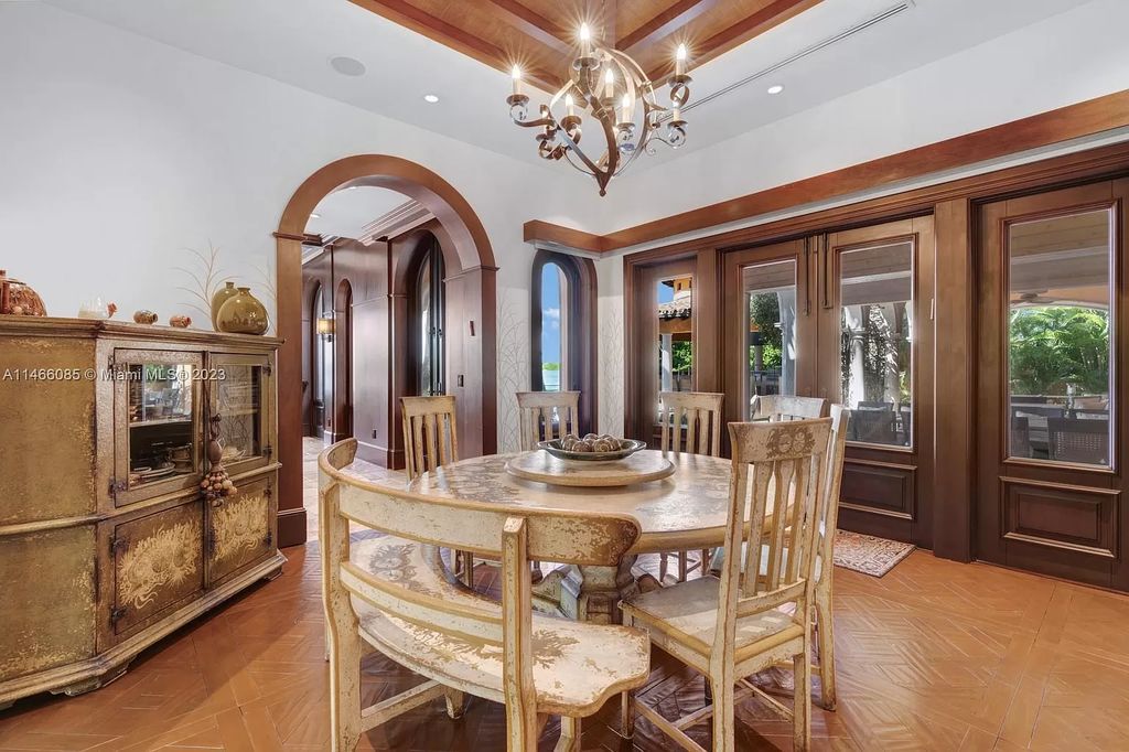 Experience the epitome of Mediterranean luxury at 230 Bal Bay Dr, an exclusive waterfront estate in Bal Harbour Village. Crafted by the esteemed Alexander Group, this custom-built masterpiece boasts exquisite details like custom millwork, Jerusalem stone flooring, and marble accents throughout.
