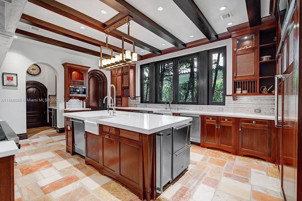 Experience the epitome of Mediterranean luxury at 230 Bal Bay Dr, an exclusive waterfront estate in Bal Harbour Village. Crafted by the esteemed Alexander Group, this custom-built masterpiece boasts exquisite details like custom millwork, Jerusalem stone flooring, and marble accents throughout.