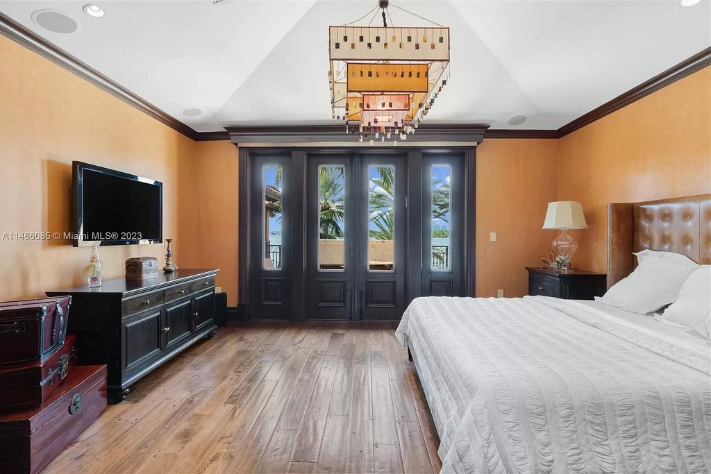 Experience the epitome of Mediterranean luxury at 230 Bal Bay Dr, an exclusive waterfront estate in Bal Harbour Village. Crafted by the esteemed Alexander Group, this custom-built masterpiece boasts exquisite details like custom millwork, Jerusalem stone flooring, and marble accents throughout.